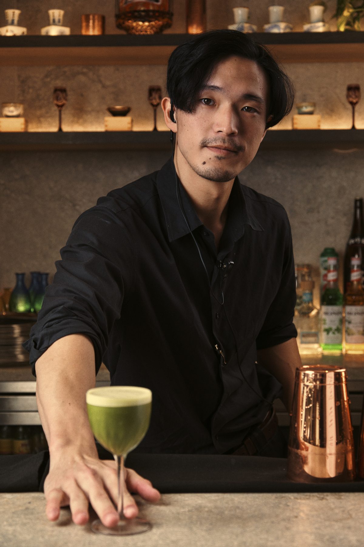 Bartender with signature cocktail