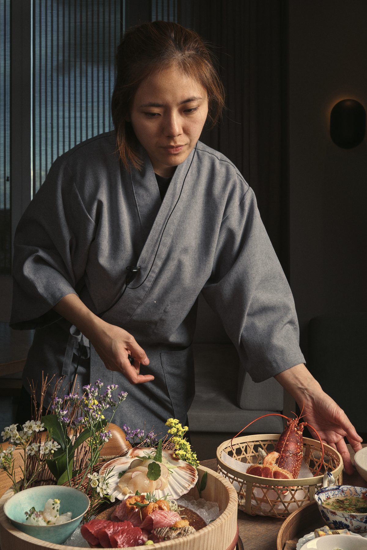 Chef plating sashimi course